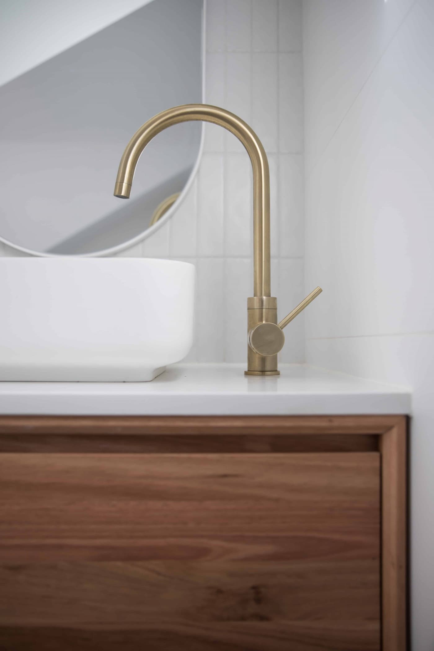 Bathroom sink with golden faucet
